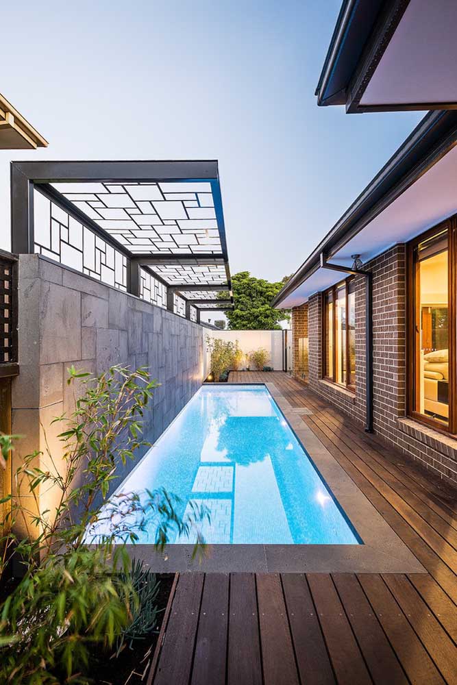 Another pool built on the side of the house.  Despite being narrow, the pool is very long and the installation of the deck throughout makes the space more charming.