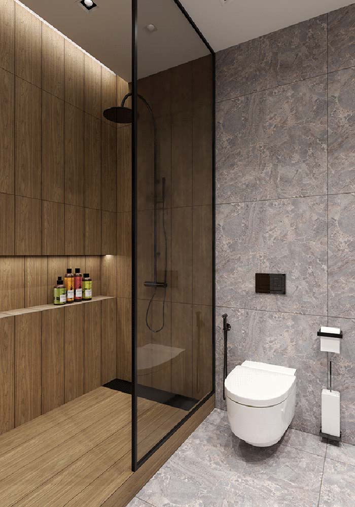 Já a combinação de banheiro amadeirado com cinza é moderna